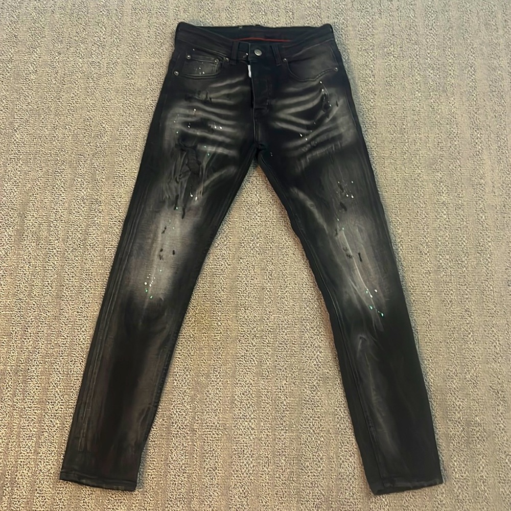 It’s a DSQUARED2 Pants Black With Limited Edition Green Paint Splatter and D802